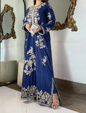 Full-length studio photography of a stitched royal blue raw silk kaftan dress adorned with premium silver and champagne tilla work.