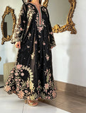 Model wearing black embroidered kaftan full length