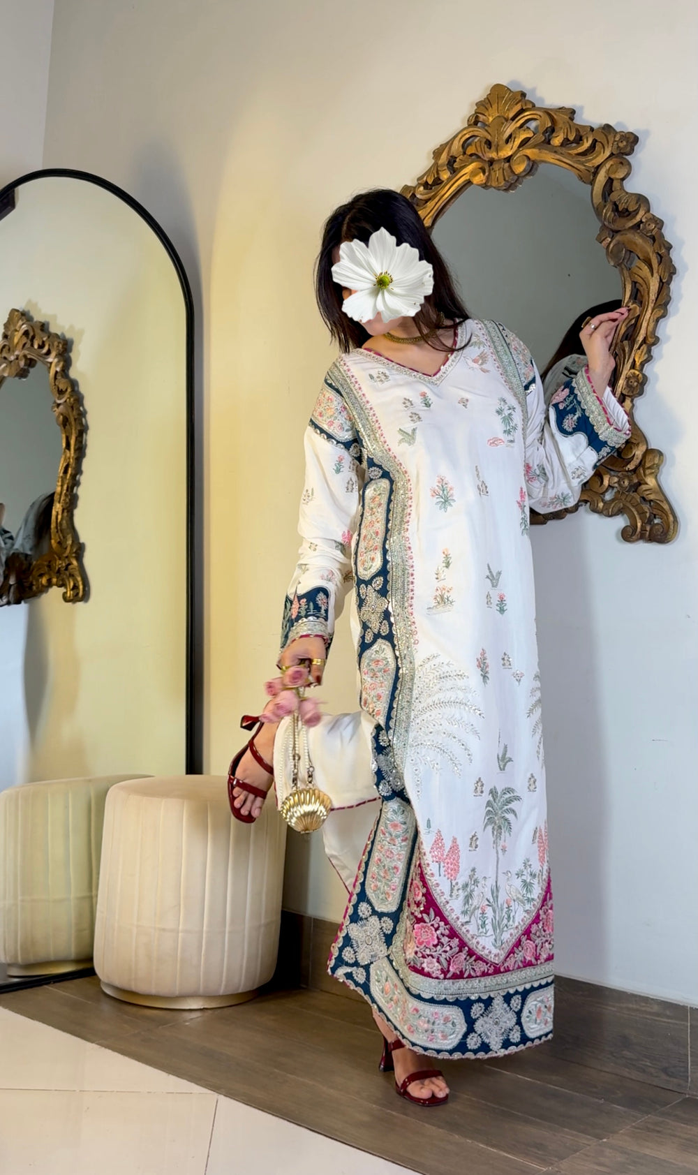 Close-up embroidered neckline ivory kaftan with silver zari border