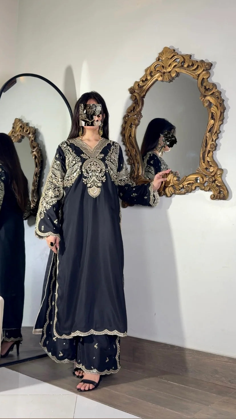 Black embroidered long shirt with side slits and scalloped hem, paired with embroidered trouser