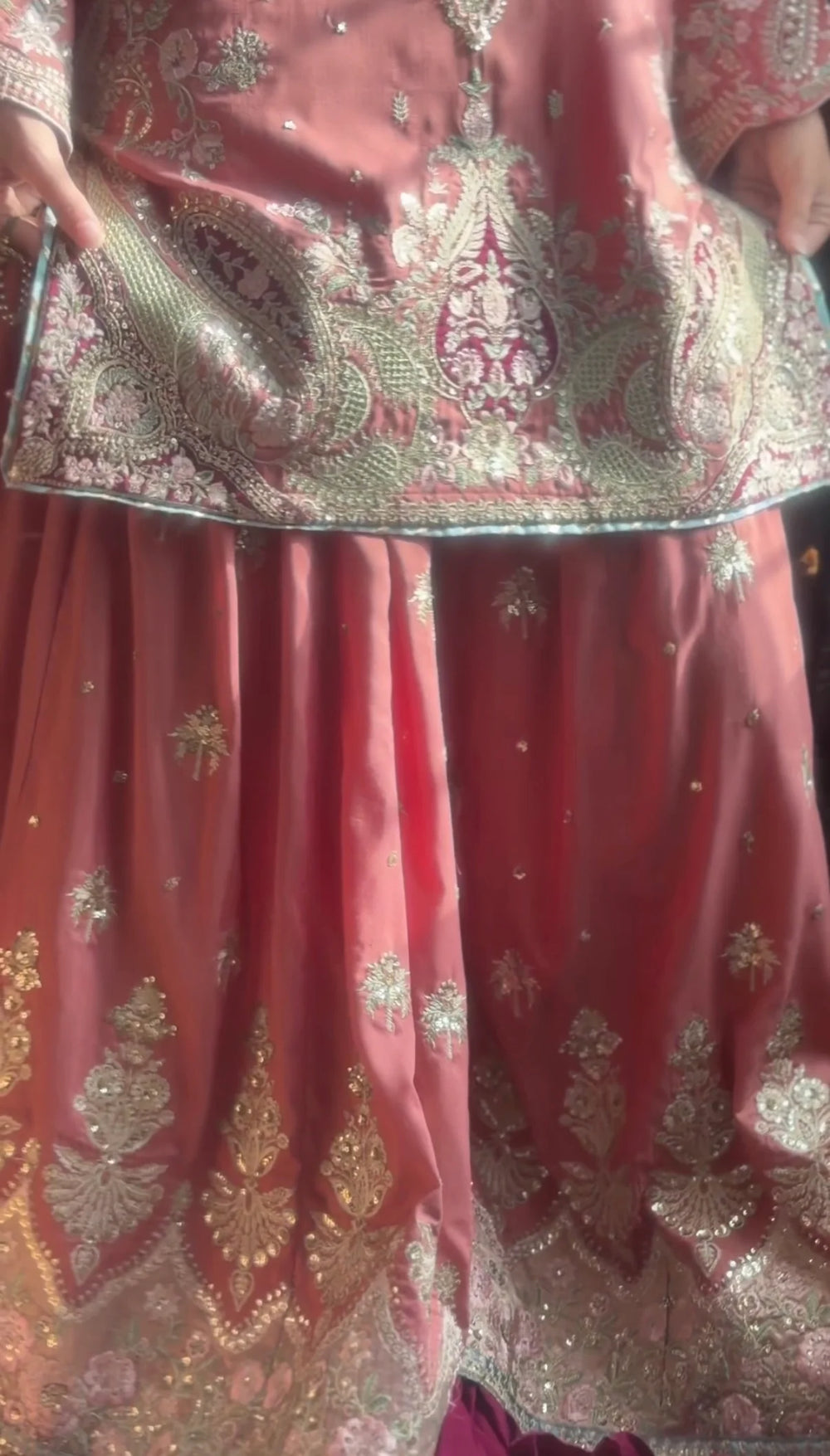 Close-up of gold zari and sequin embroidery on rose pink viscose gharara hem and shirt daaman