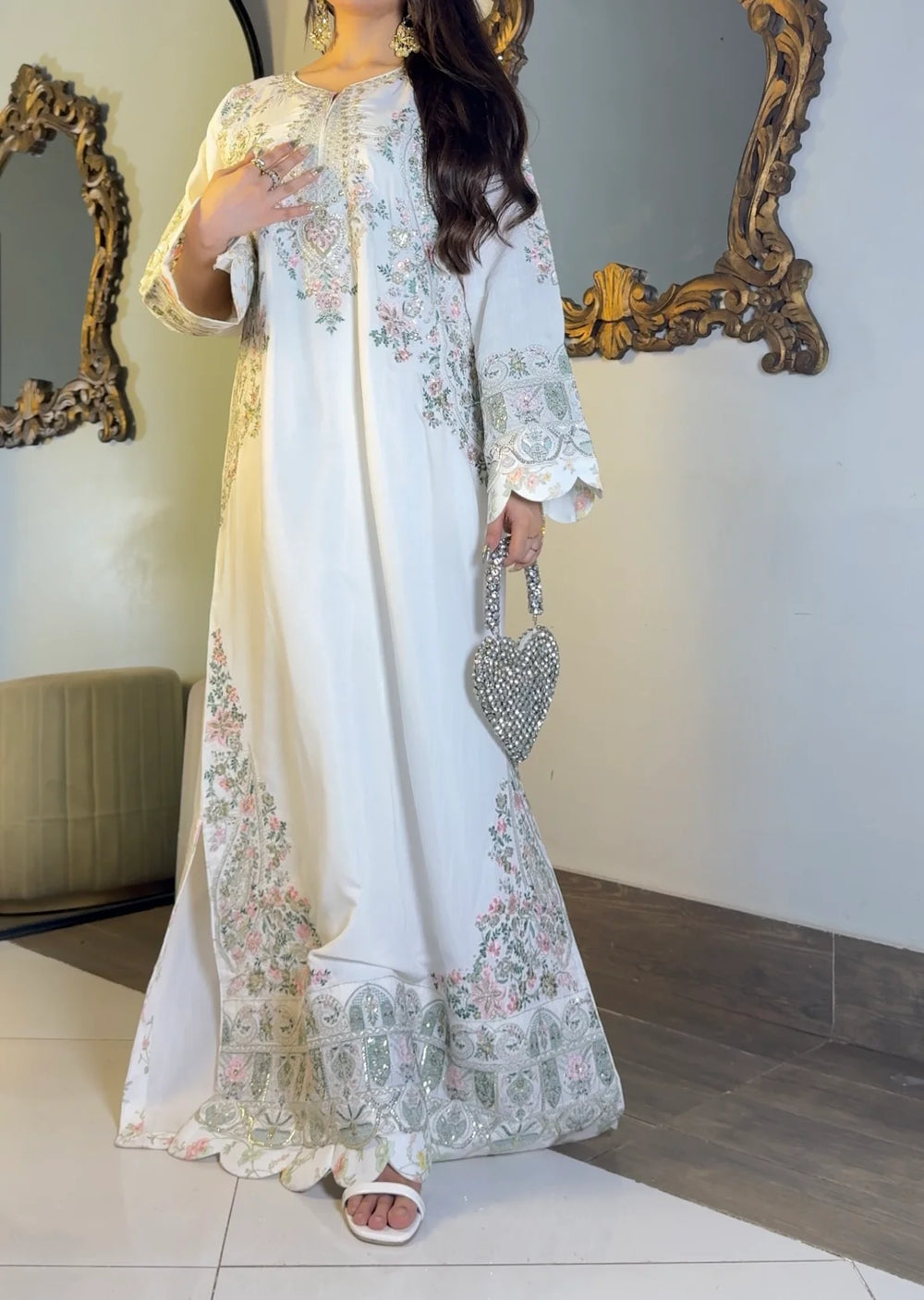 Ivory embroidered kaftan side view showing bell sleeve and hem embroidery