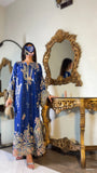 Model styled with dupatta draped over head, wearing royal blue embroidered kaftan suit