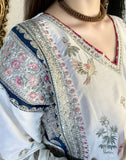 Model wearing ivory navy embroidered luxury kaftan with pink roses