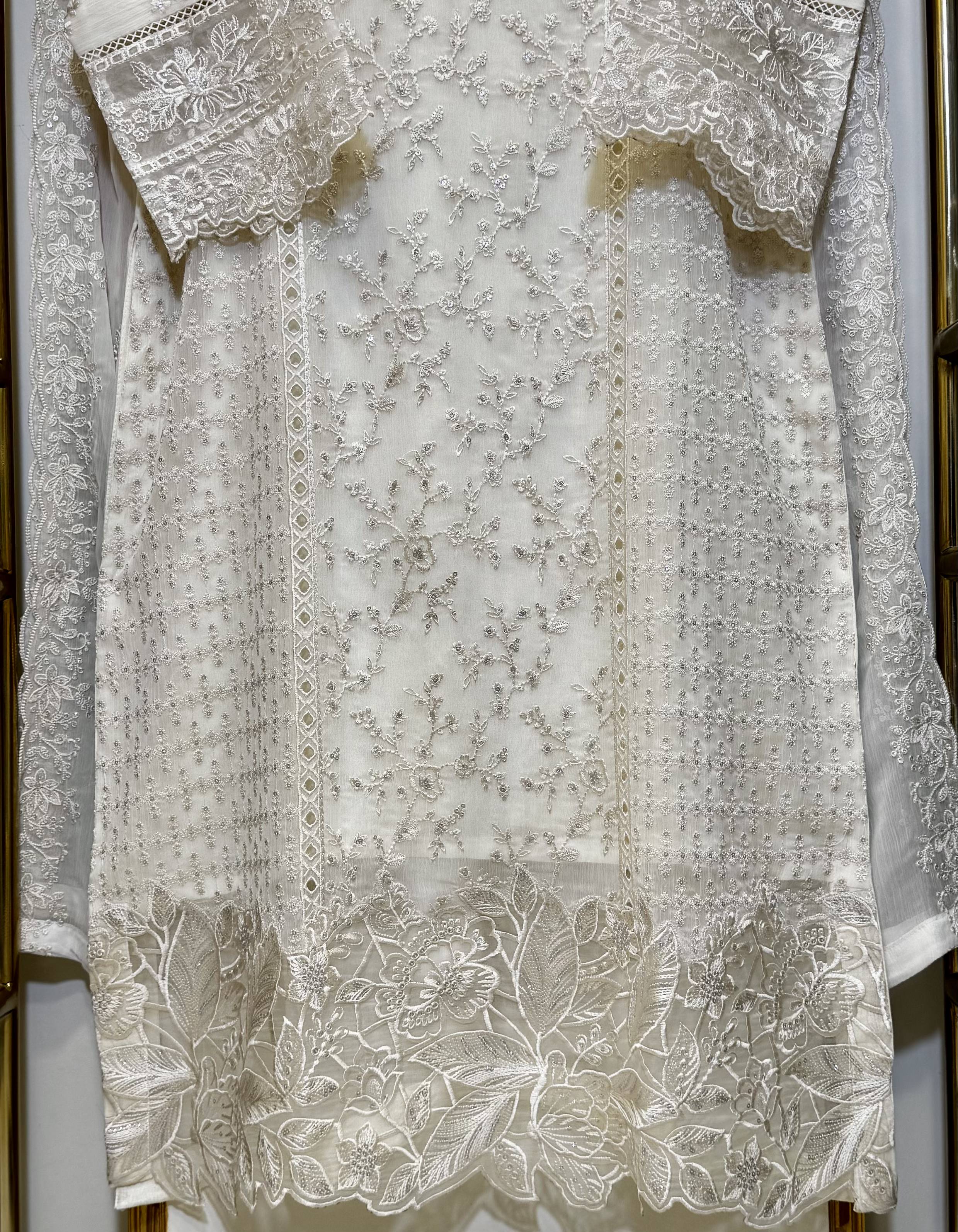 Front view of sequins embroidered chiffon shirt with organza neck patch and borders