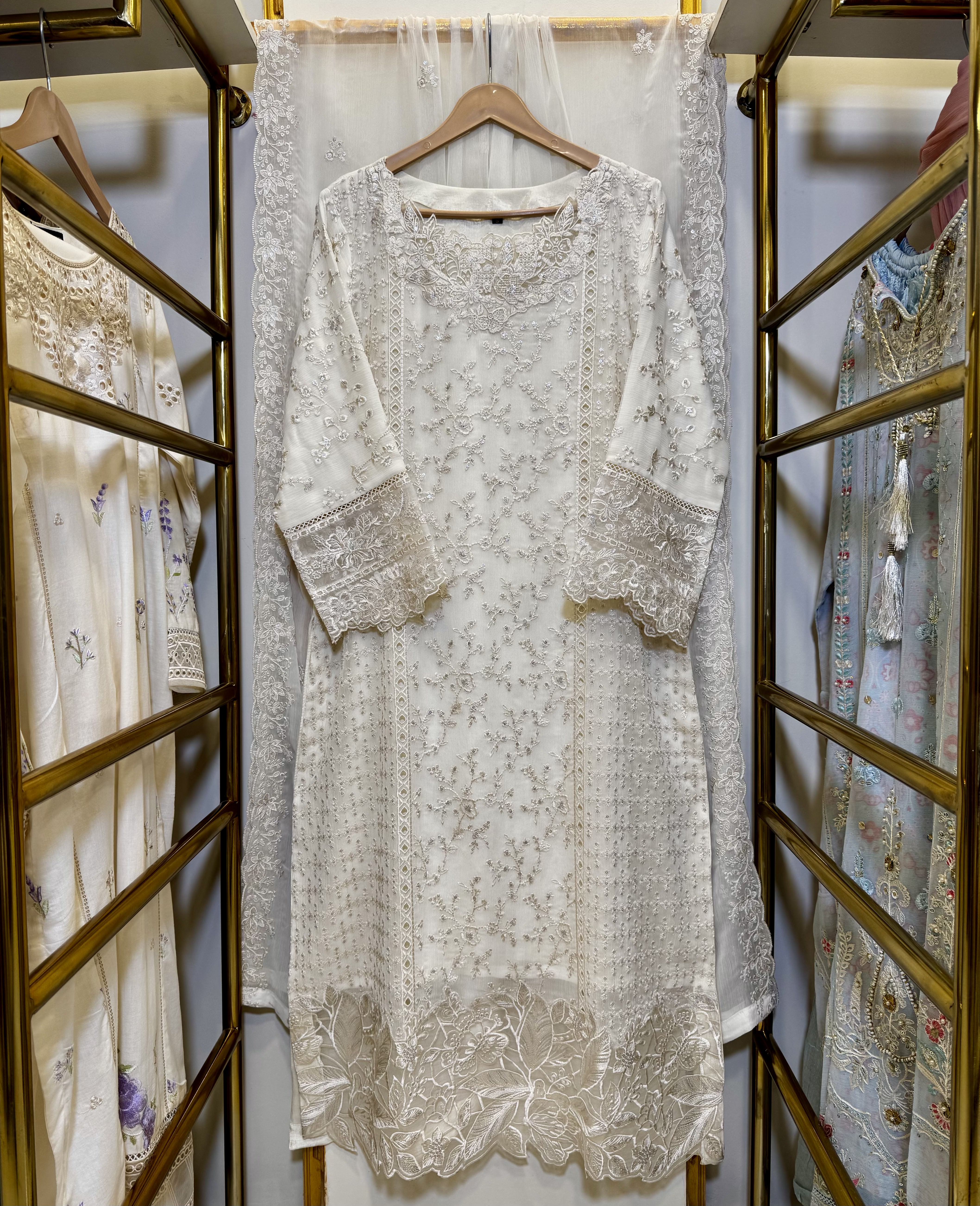 Front view of sequins embroidered chiffon shirt with organza neck patch and borders