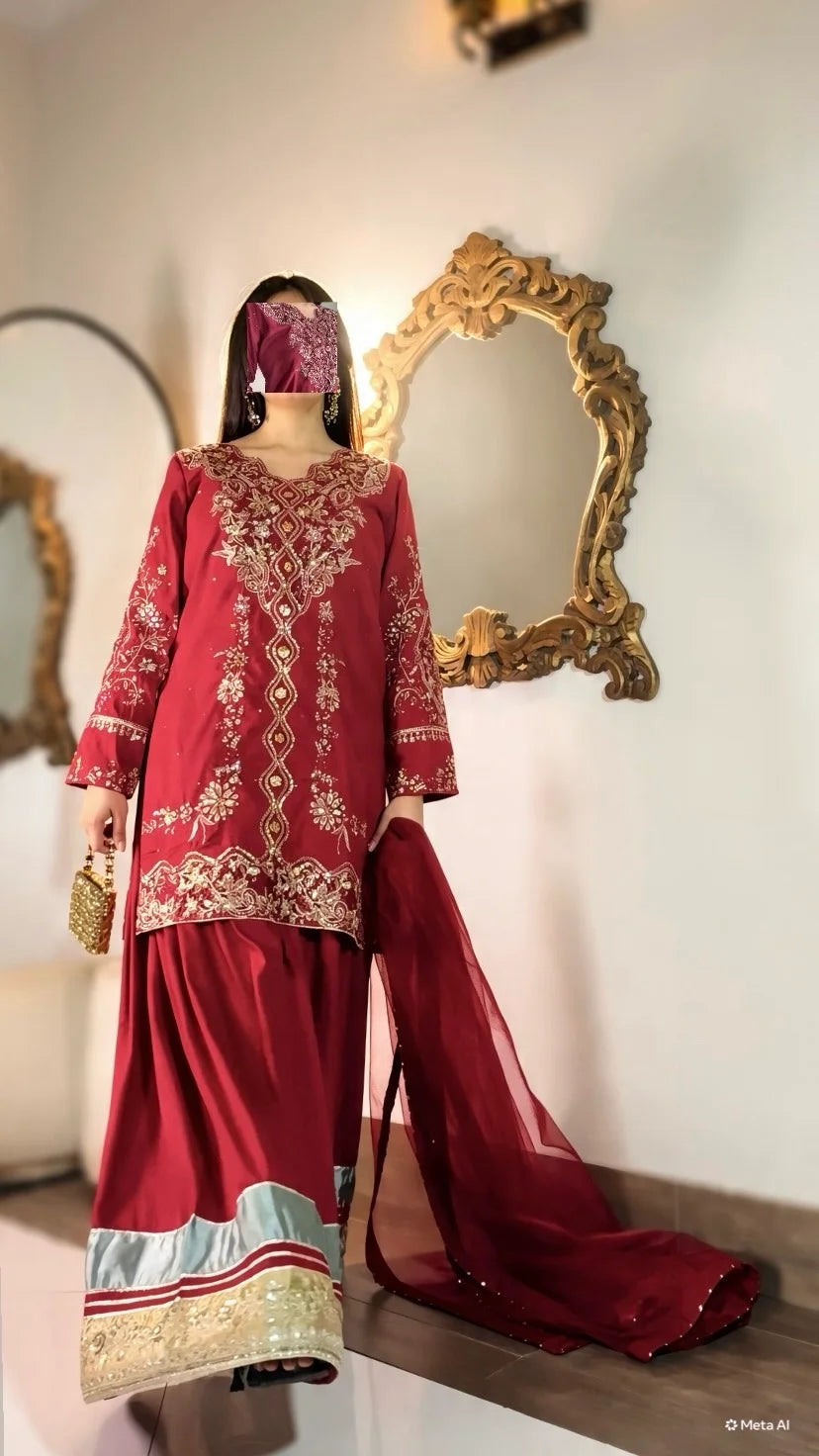 Close-up of chikankari cutwork and heavy sleeve embroidery on Qirmiz maroon shirt